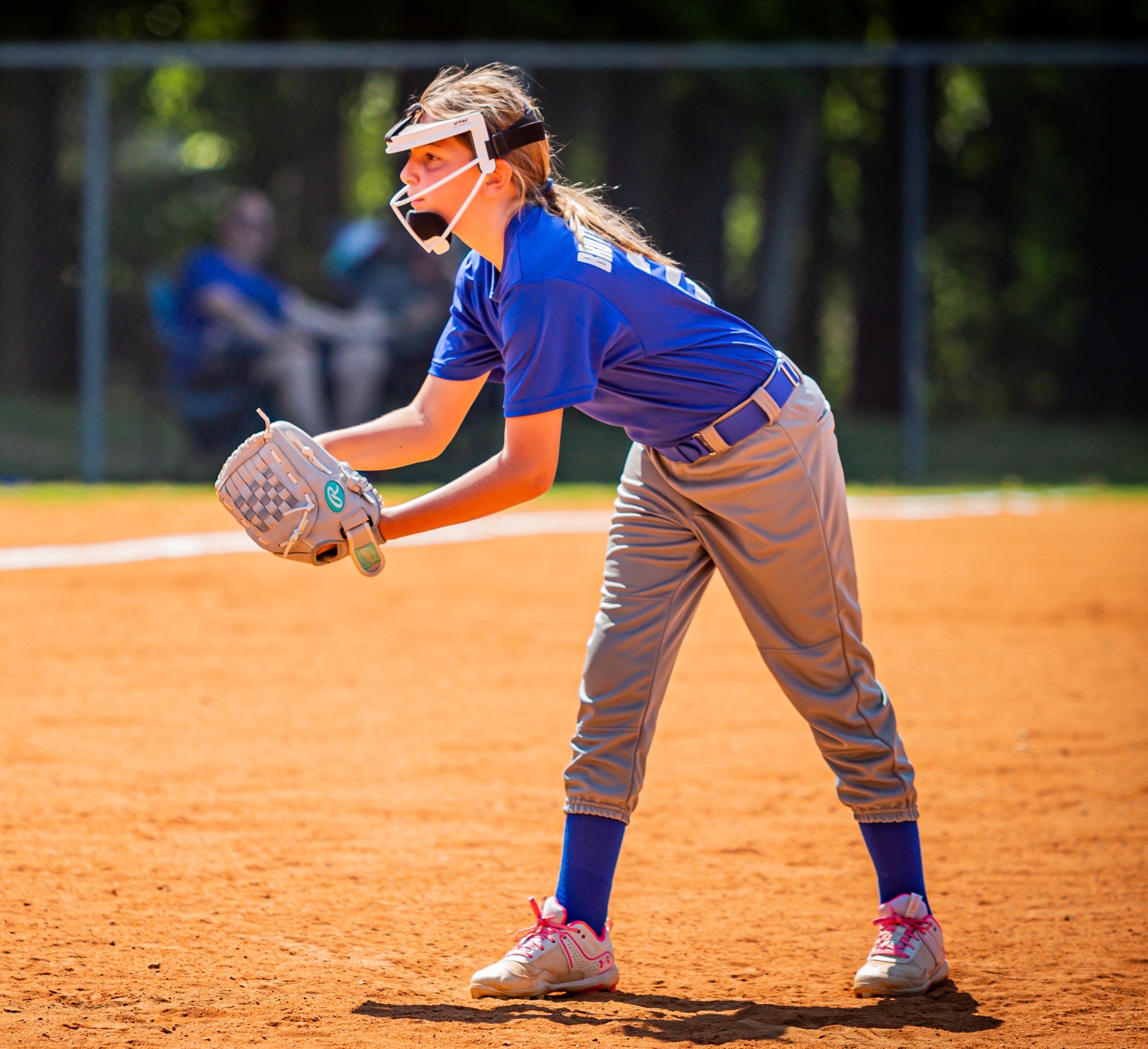 girl pitching softball
