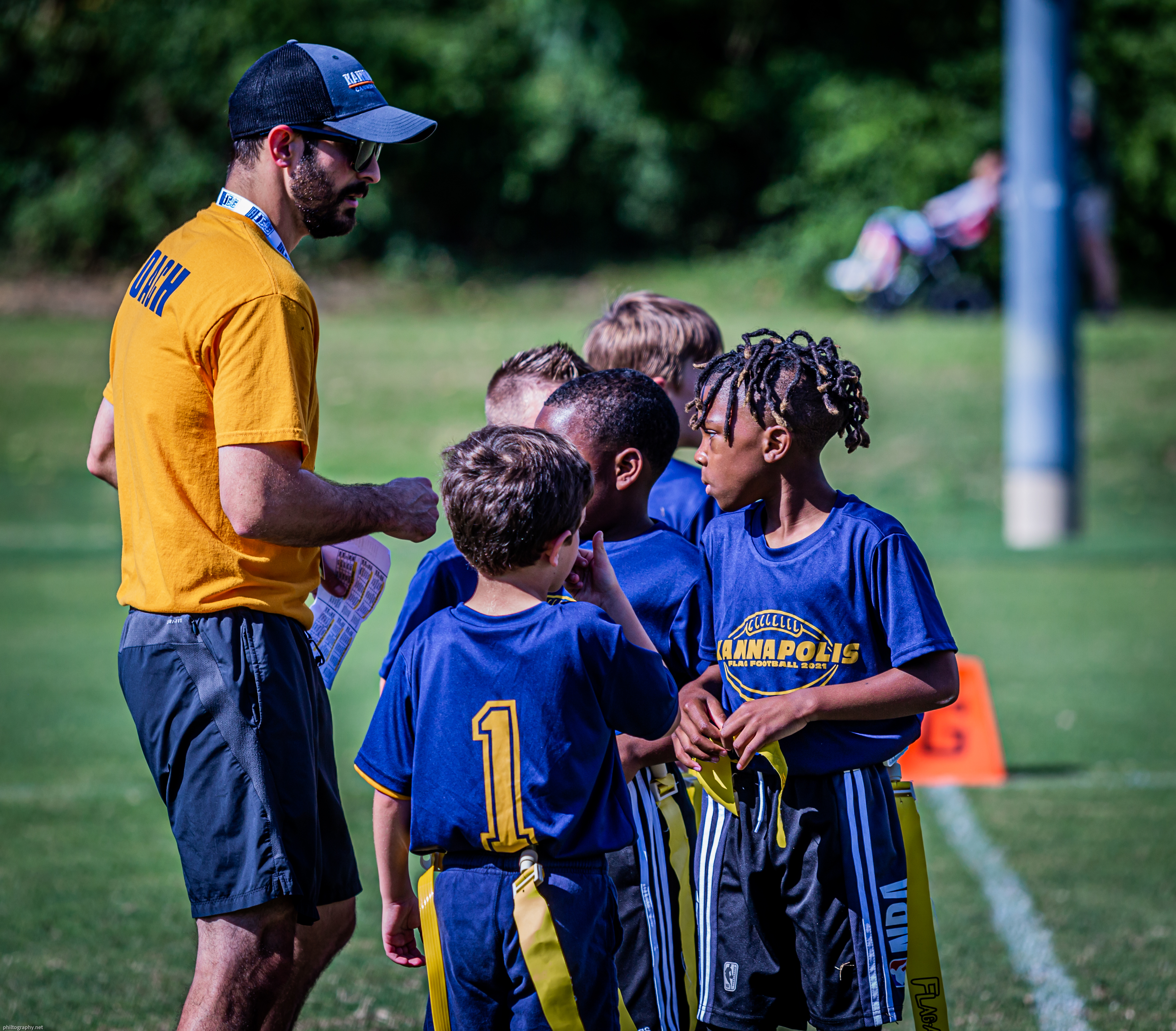 flag football coach with players