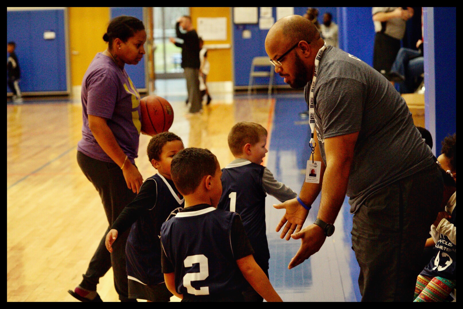 Basketball coach with players